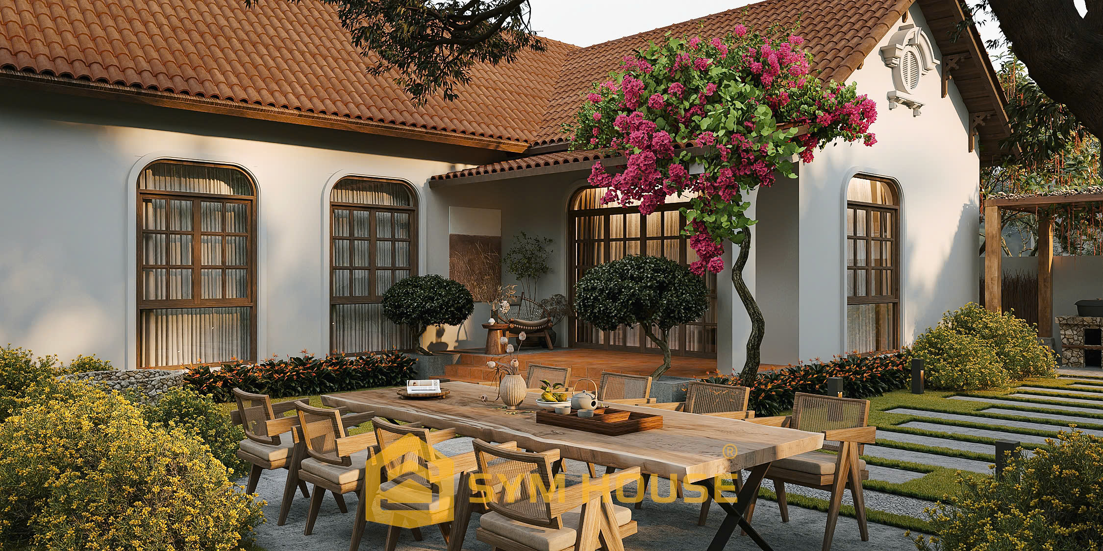 Không gian sân vườn nhà ở kết hợp không gian thờ cúng tại Thanh Hoá với bàn ăn ngoài trời, mái ngói đỏ truyền thống và thiết kế mở chan hòa thiên nhiên do SYM HOUSE thực hiện.